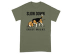 Olive green t-shirt with a beagle sniffing grass and text "SLOW DOWN ENJOY WALKS".
