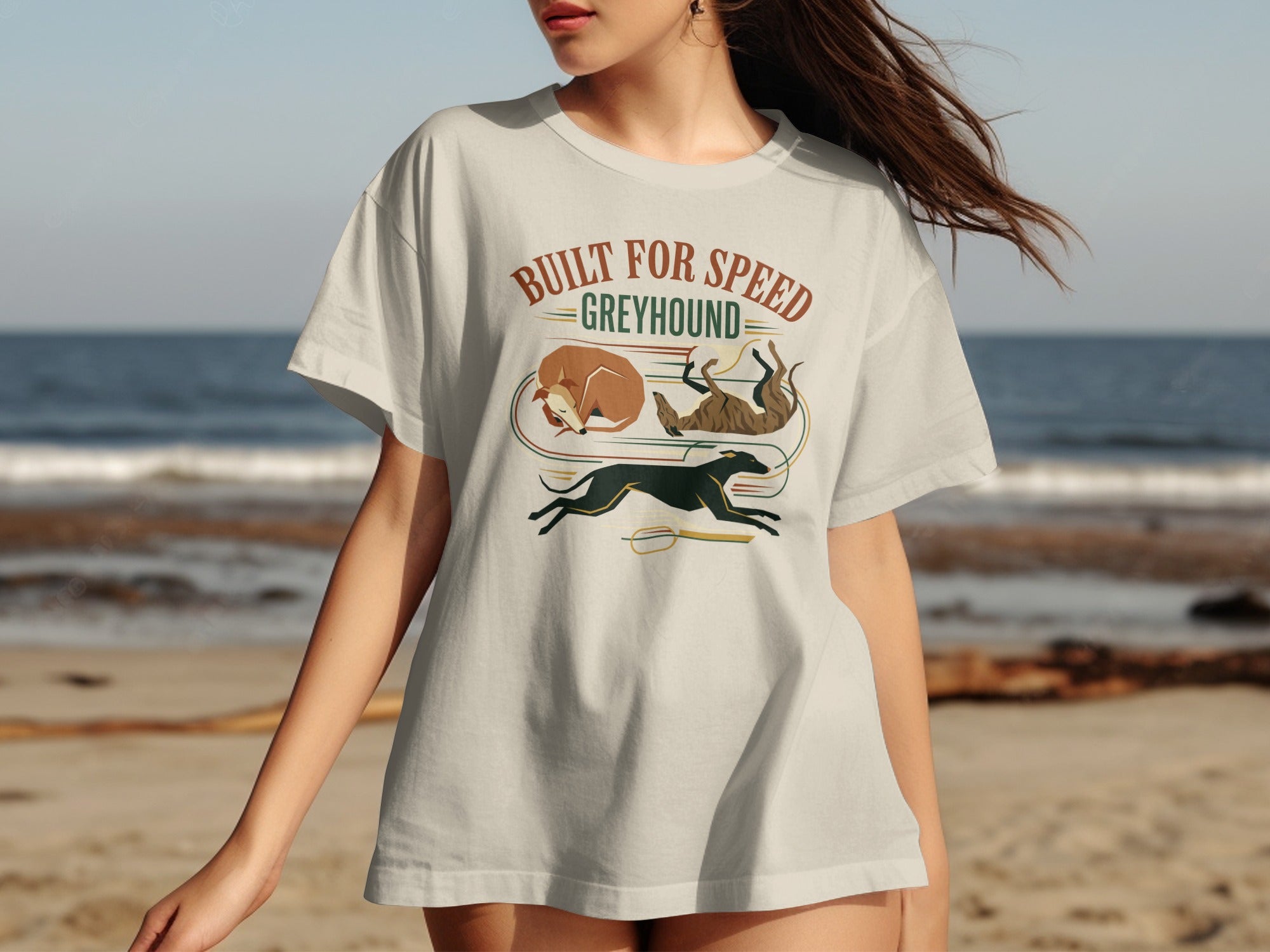 Greyhound t-shirt with "Built for Speed" text and stylized greyhounds on beach background.