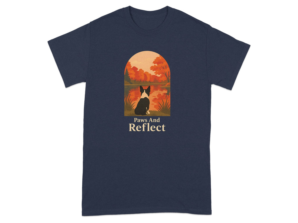 T-shirt with graphic of dog sitting by water with autumn trees and text "Paws And Reflect".