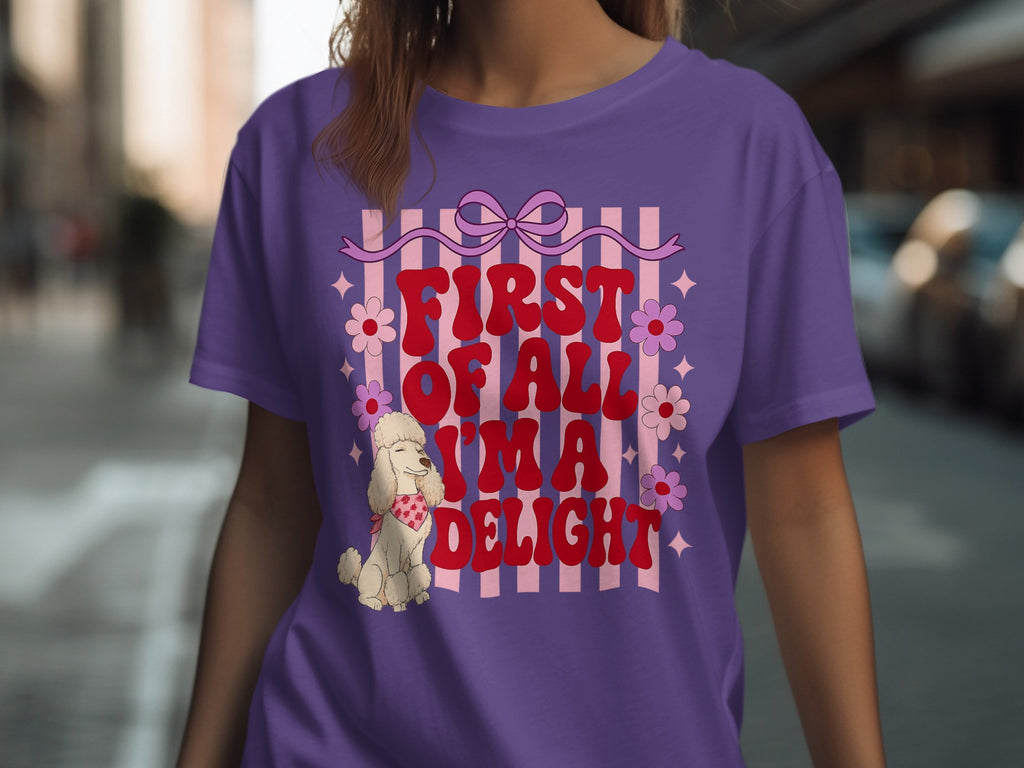 Purple t-shirt with "First of All, I'm aimal Delight" text and floral accents.