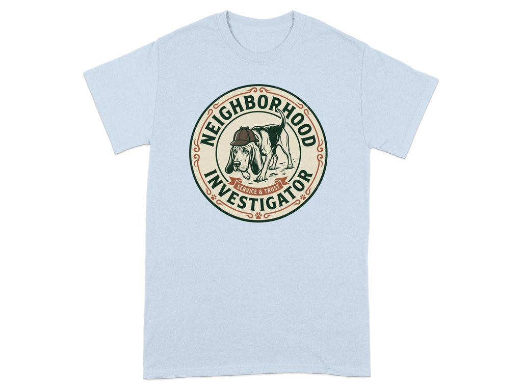 Light blue t-shirt with a circular graphic of a dog wearing a hat, labeled "Neighborhood Investigator."