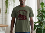Green t-shirt with brown dog sniffing forward, text "TRUST THE NOSE".