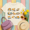Whimsical Corgi Quilter's Chronicle T-Shirt in Natural