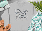 Grey sweatshirt with a line drawing of a dog and leash, text "Slow down, enjoy walks."