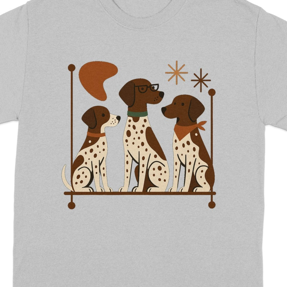 Three brown and white spotted dogs sit on a shelf with decorative elements.
