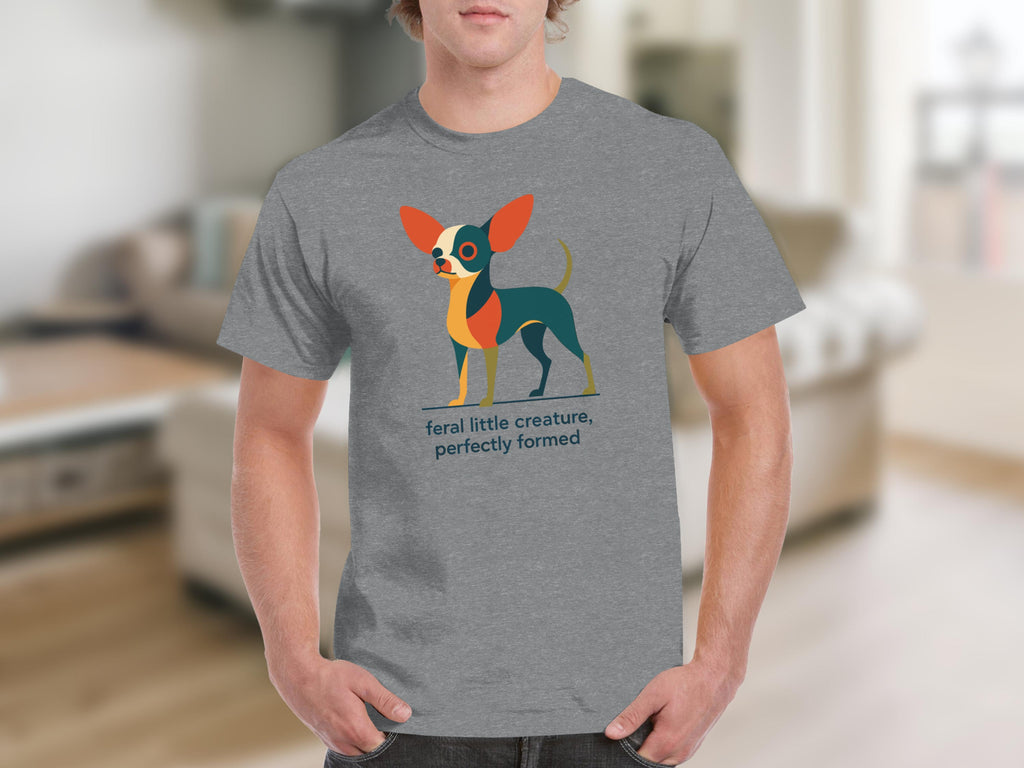 Grey t-shirt with a colorful stylized chihuahua and text that reads "feral little creature, perfectly formed".