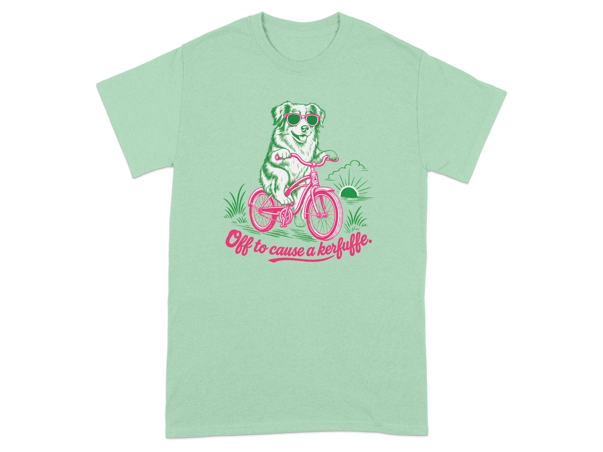 Green t-shirt with dog on bicycle wearing sunglasses and text "Off to cause a kerfuffle."