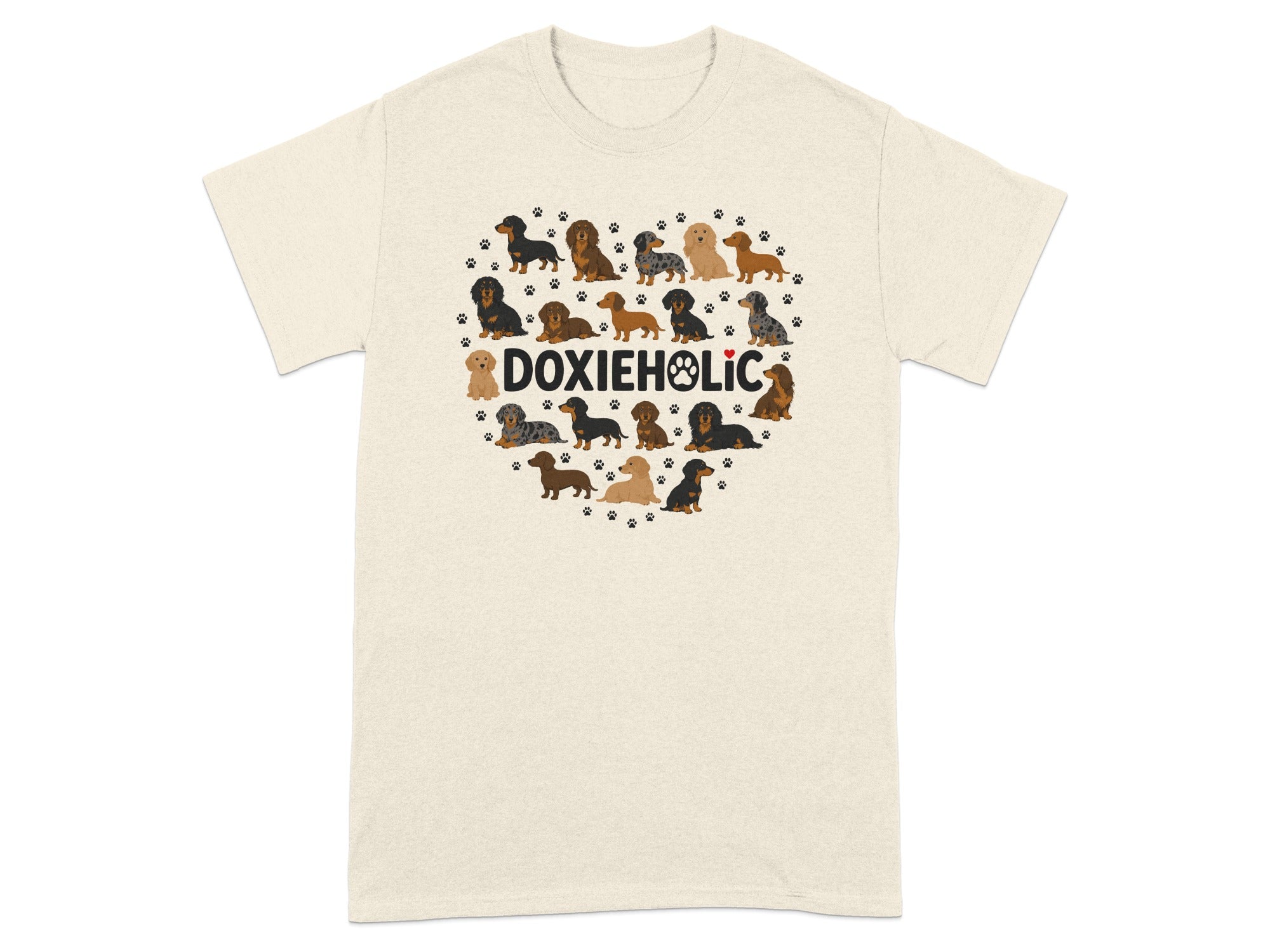 Dachshunds form a heart shape above the text DOXIEHOLIC on a cream t-shirt.
