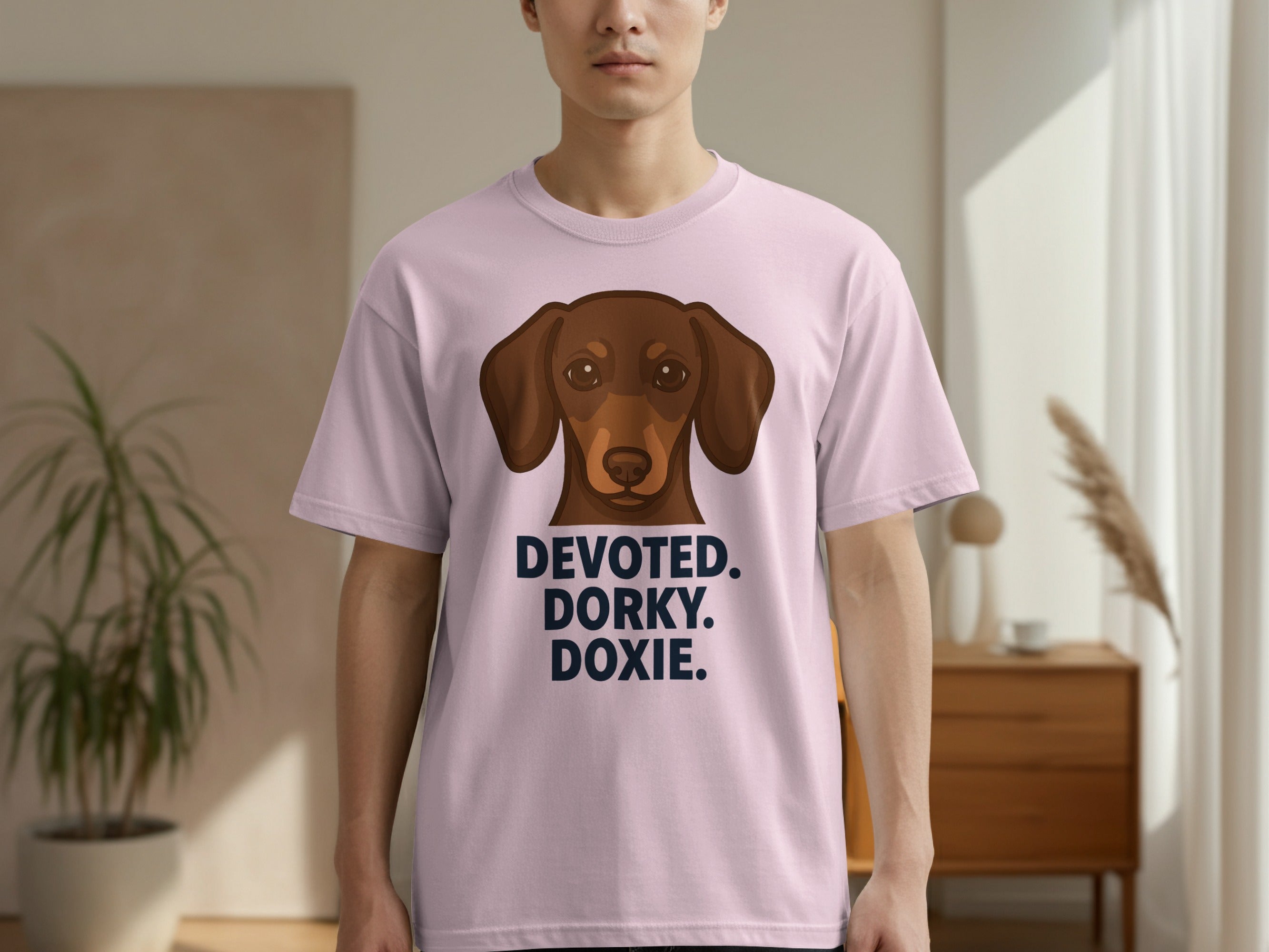 Pink t-shirt with a brown dachshund and the text "DEVOTED. DORXY. DOXIE."