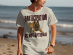 Light tan t-shirt with a Belgian Malinois dog and text "PARTICIPATION IS NOT OPTIONAL".