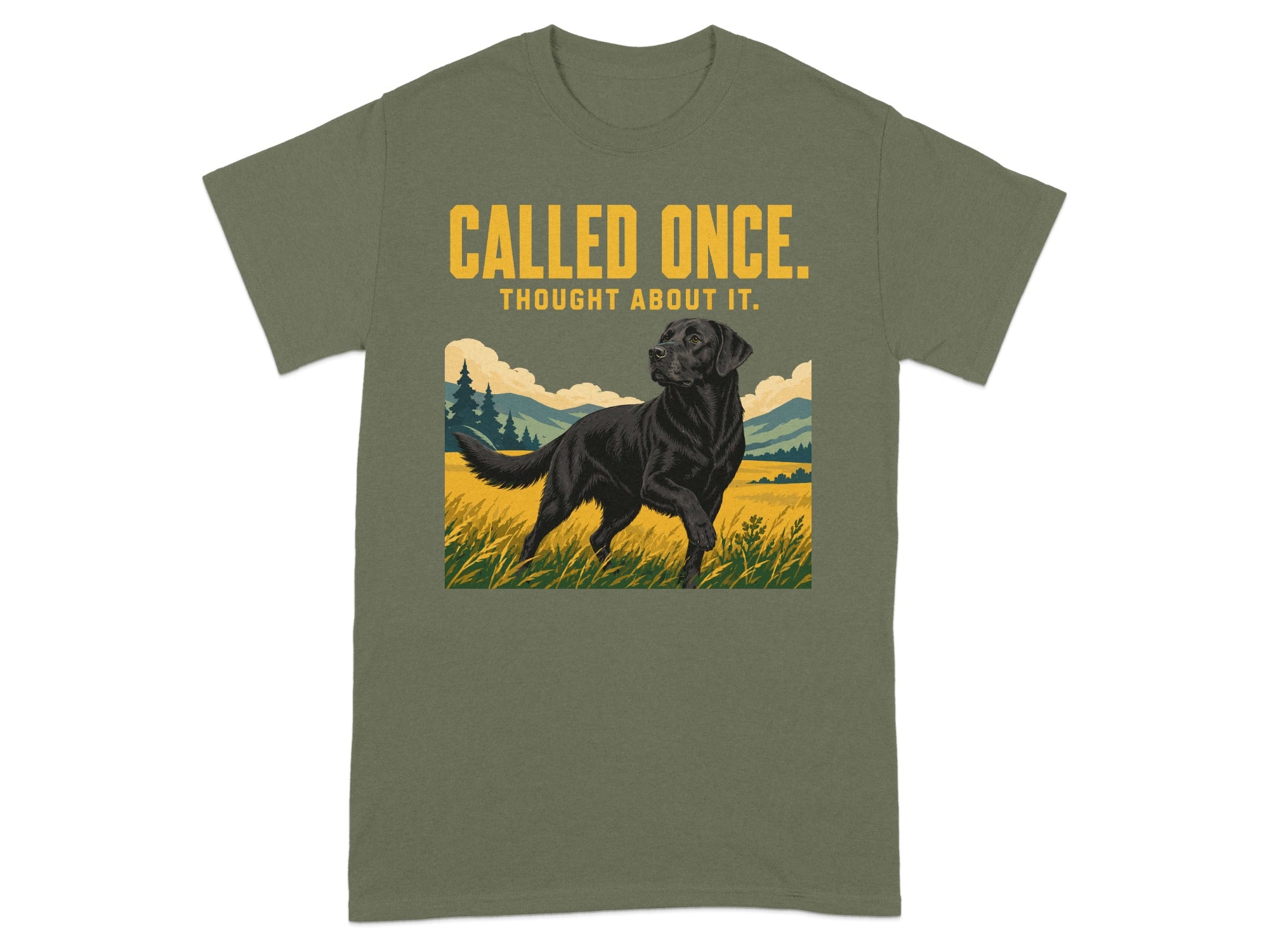Black Labrador in grassy field on olive green t-shirt with text.
