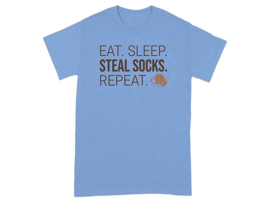 Light blue t-shirt with brown text "EAT. SLEEP. STEAL SOCKS. REPEAT." and a dog graphic.