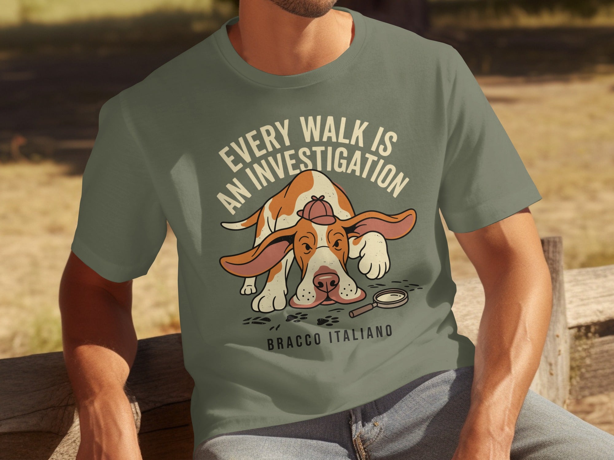 Green t-shirt with "Every Walk is an Investigation Bracco Italiano" and a dog detective.