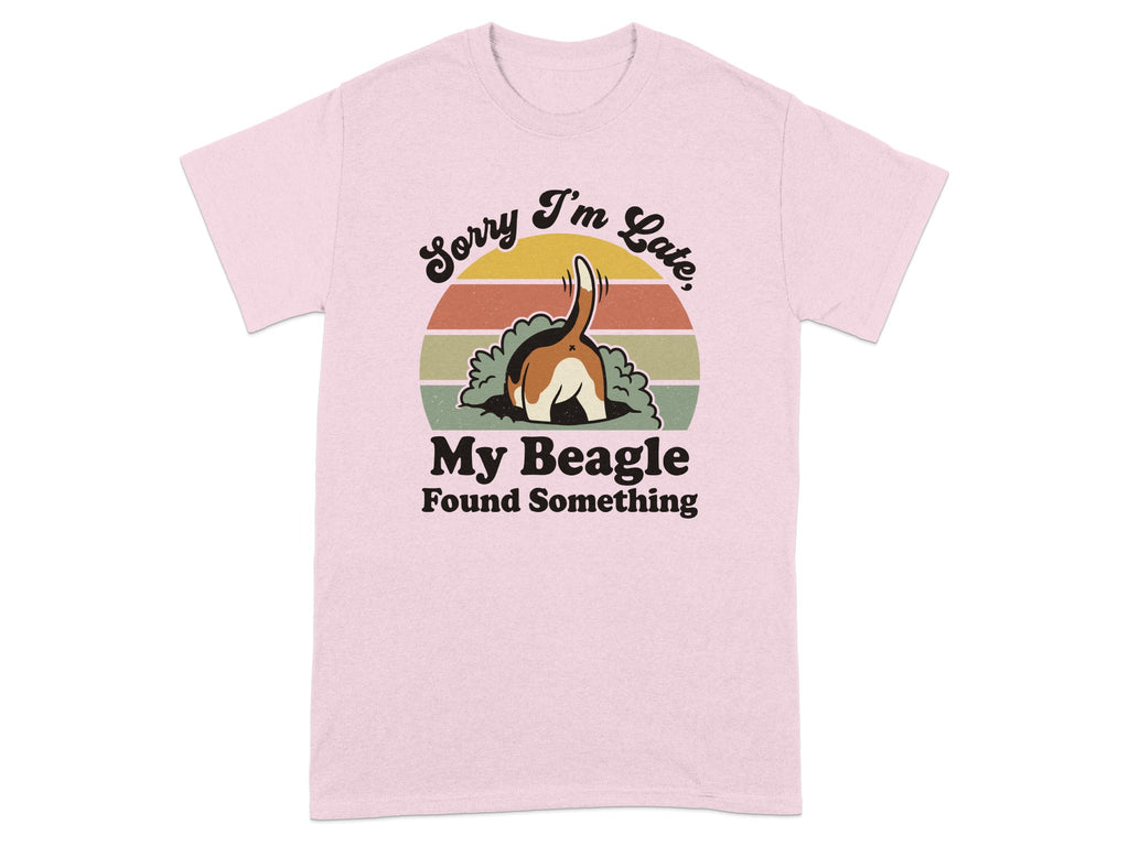 Pink t-shirt with text "Sorry I'm Late, My Beagle Found Something" and dog's hindquarters.