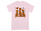 Three brown dogs sit together on a shelf graphic on a pink shirt.
