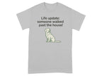 Grey t-shirt with a white dog graphic and "Life update: someone walked past the house!" text.