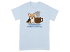 Light blue t-shirt with a corgi and coffee cup graphic, text says "Powered by Corgi & Coffee".