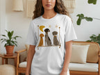 T-shirt featuring three dogs sitting together with abstract decorative elements.