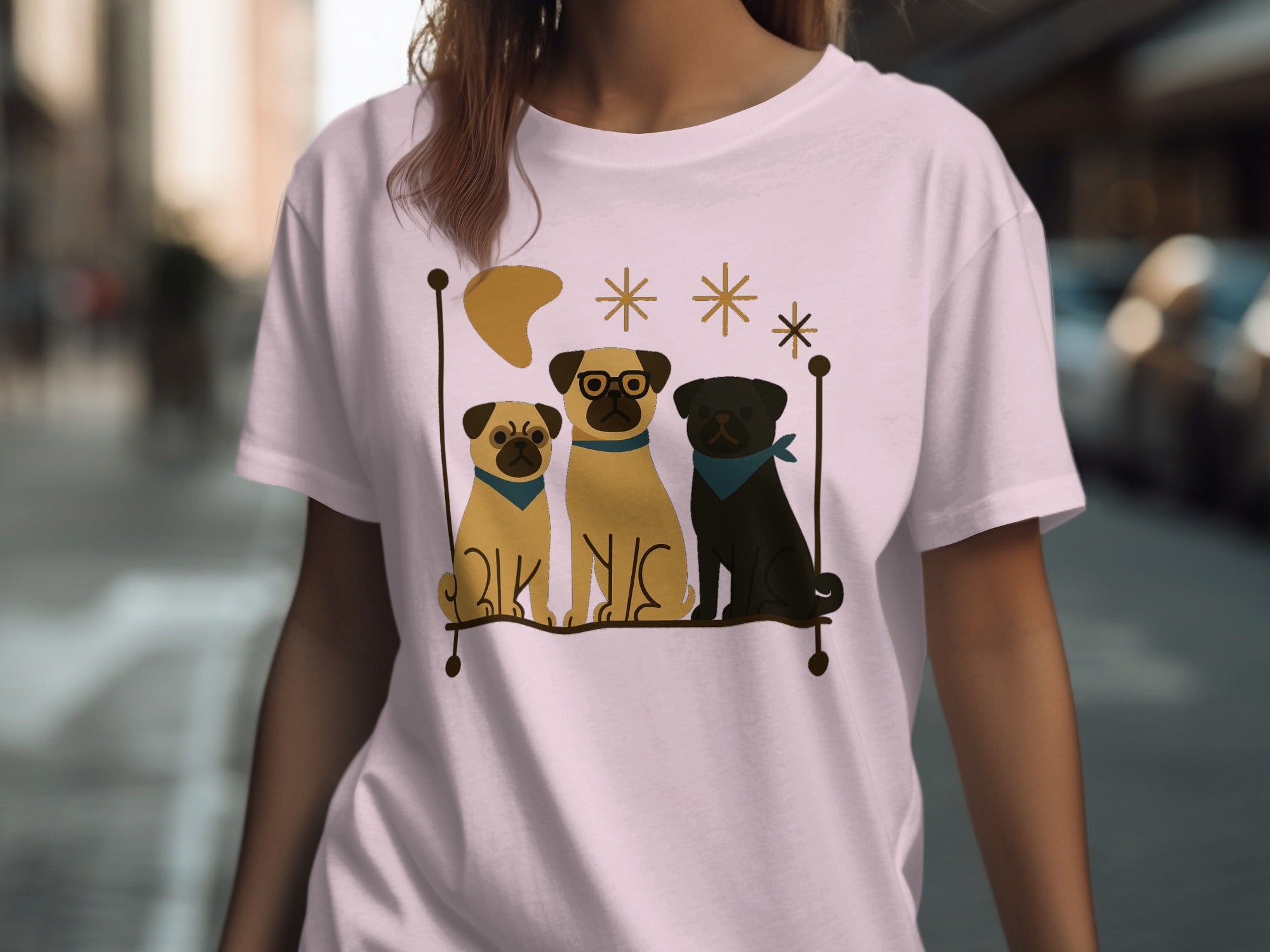 Three pugs sit on a perch with a moon and stars decoration.