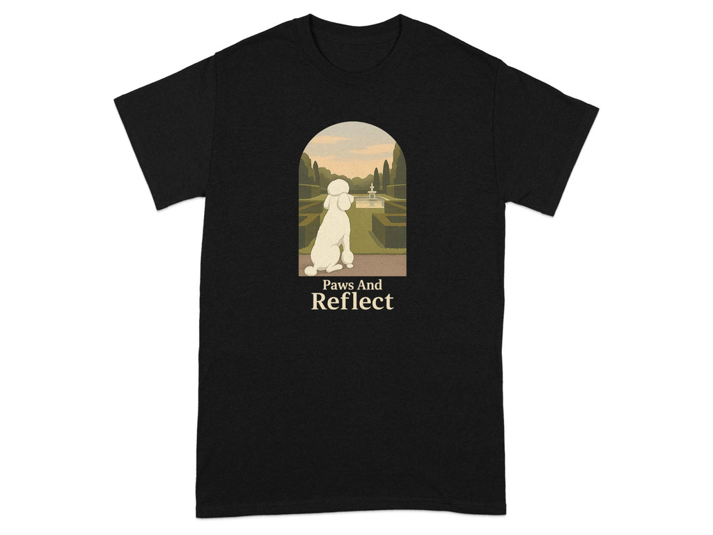 Black t-shirt with graphic of poodle looking at garden. Text says Paws And Reflect.