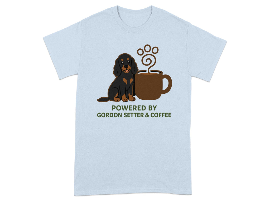Gordon Setter dog sits next to a coffee cup with paw print steam on a light blue t-shirt.