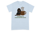 Gordon Setter dog sits next to a coffee cup with paw print steam on a light blue t-shirt.