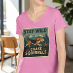 Pink v-neck t-shirt with "Stay Wild Chase Squirrels" graphic featuring a dog and squirrel.
