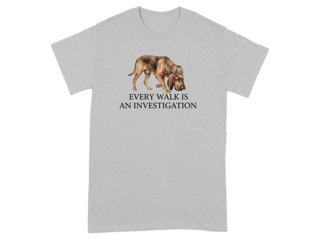 T-shirt with watercolor illustration of a bloodhound wearing a deerstalker hat, text "EVERY WALK IS AN INVESTIGATION".