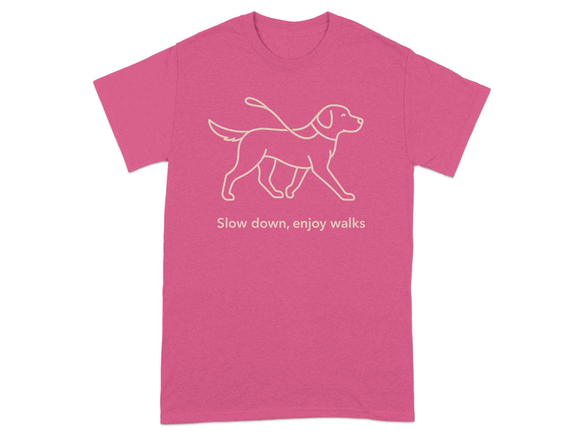 Pink t-shirt with line drawing of dog on leash and text "Slow down, enjoy walks".