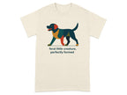 Cream t-shirt with a geometric dog graphic and text "feral little creature, perfectly formed".
