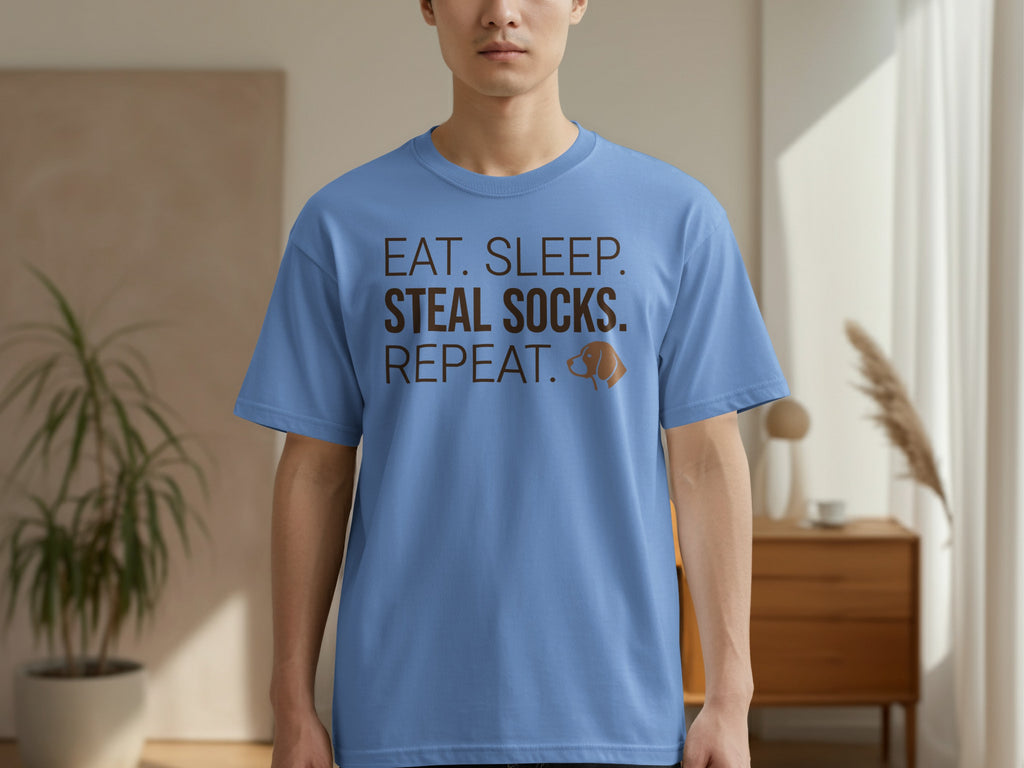 Blue t-shirt with "Eat. Sleep. Socks. Repeat." text and a dog illustration.