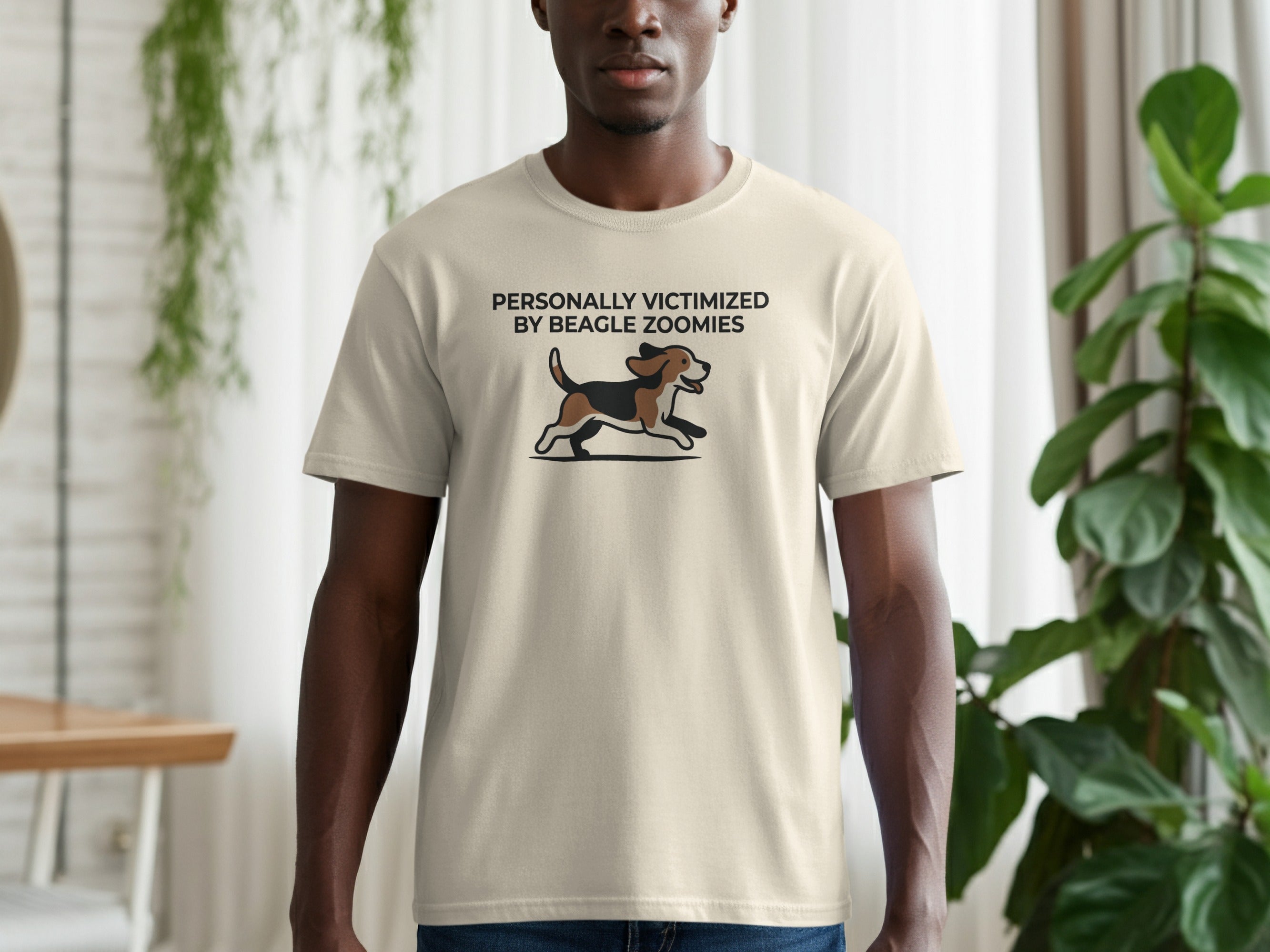 T-shirt with text "PERSONALLY VICTIMIZED BY BEAGLE ZOOMIES" and a running beagle graphic.
