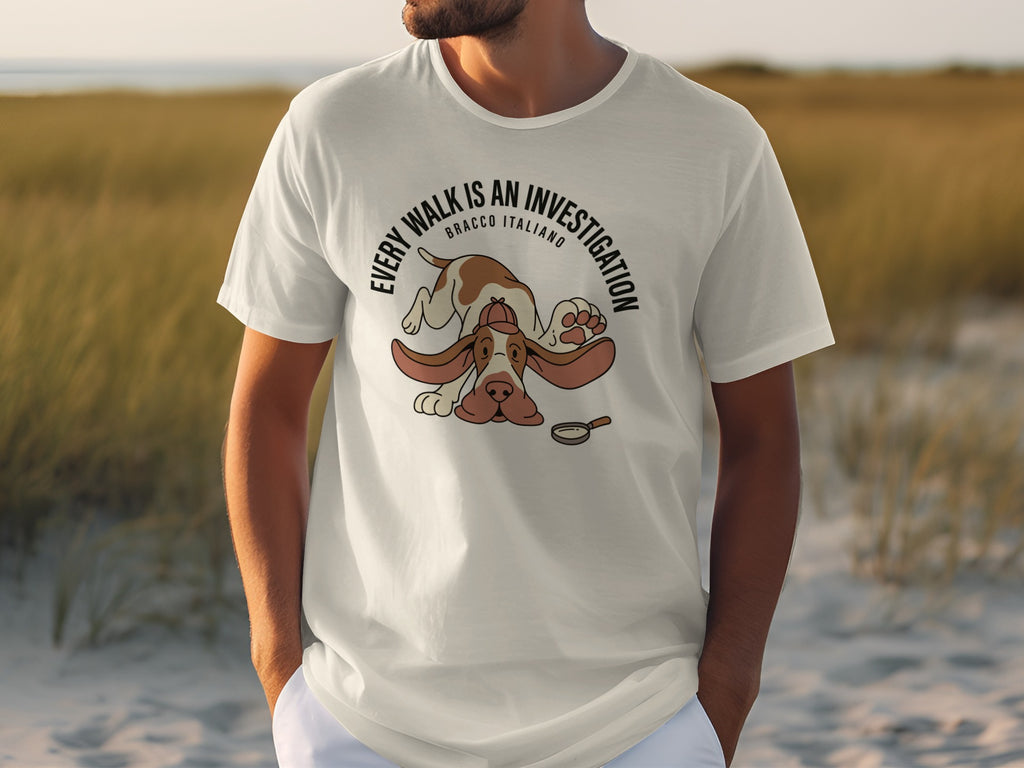 Bracco Italiano dog wearing a t-shirt with text "Every Walk is an Investigation".