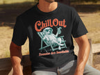 Black t-shirt with dog in a lounge chair, text "Chill Out" and "Zoomies Are Inevitable".