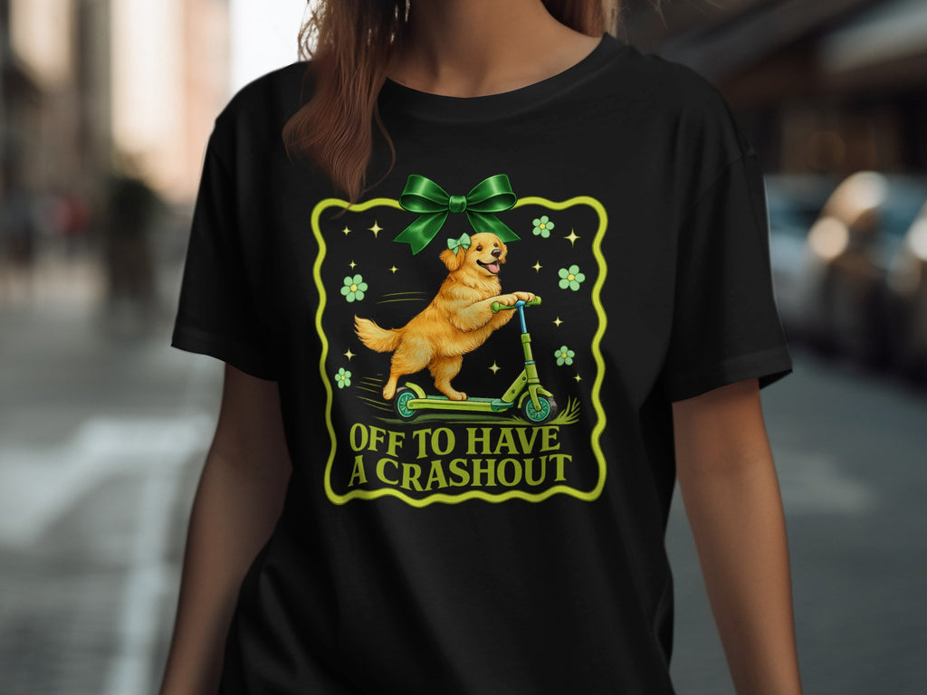 Golden retriever on a scooter with green bow and text "OFF TO HAVE A CRASHOUT".