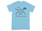 Light blue t-shirt with a dotted dog graphic and the text "Slow down, enjoy walks".