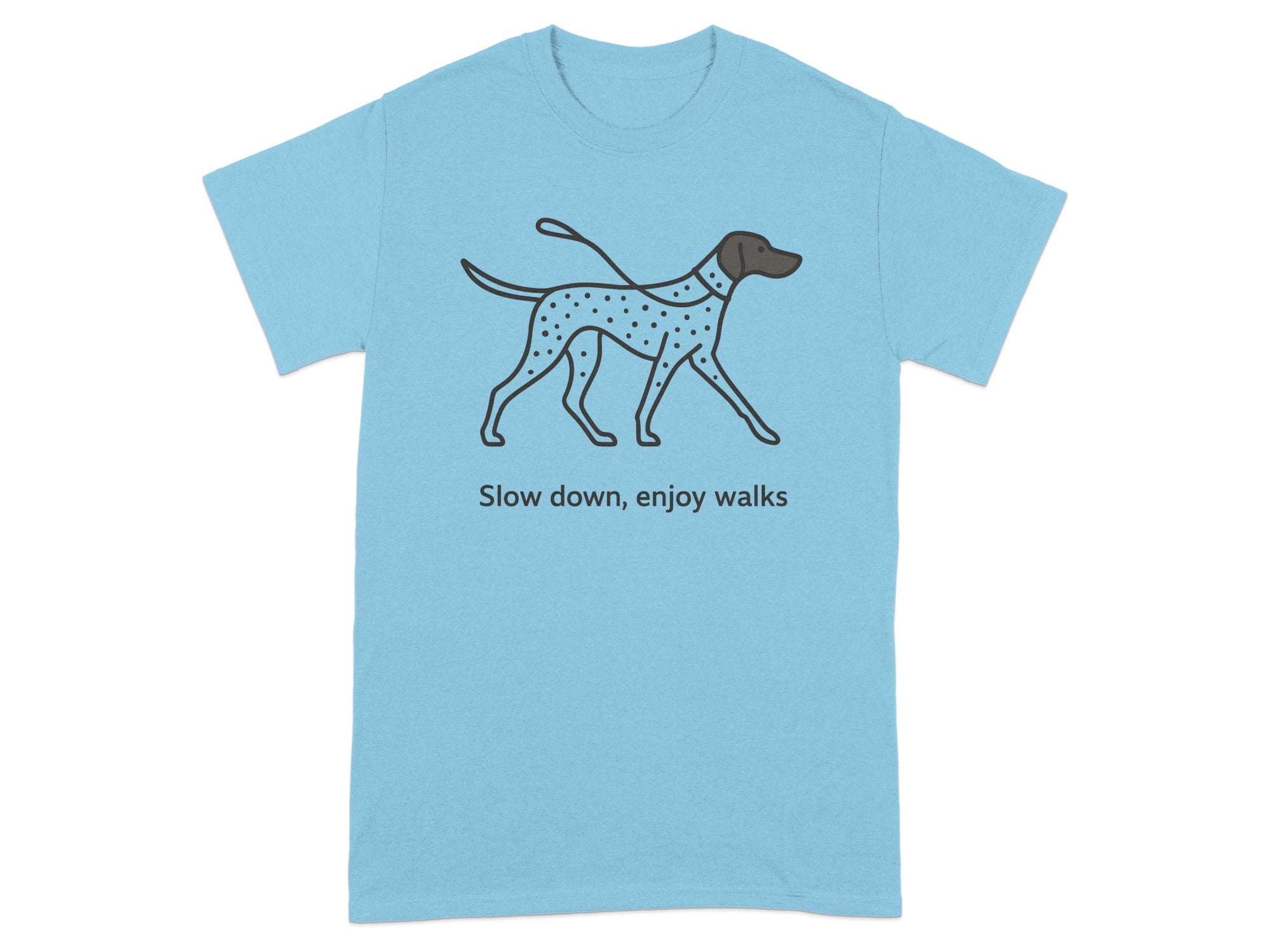 Light blue t-shirt with a dotted dog graphic and the text "Slow down, enjoy walks".