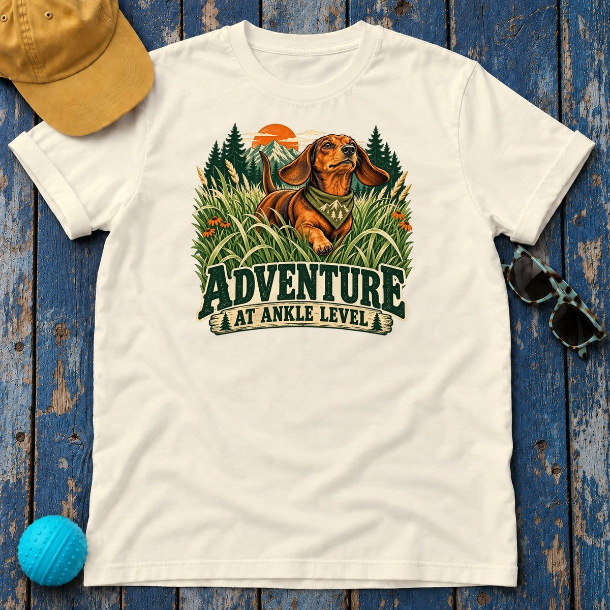 Adventure at Ankle Level Dachshund T-Shirt in Natural - flat lay