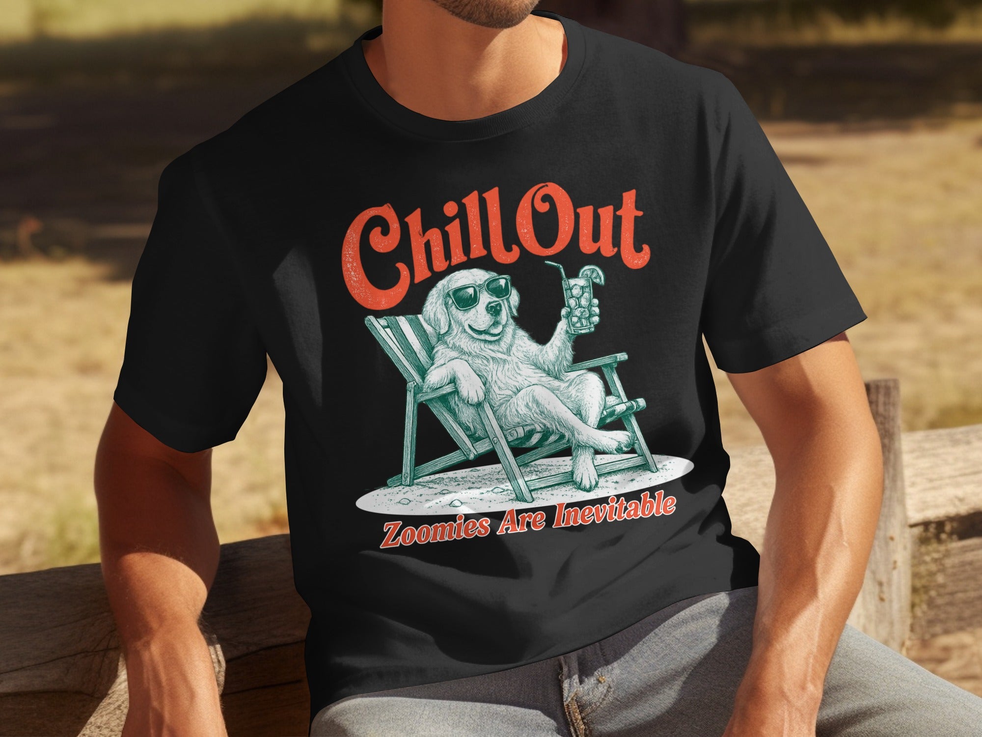 Black t-shirt with a relaxed dog in a deck chair, wearing sunglasses and holding a drink.