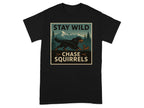 Black t-shirt graphic with dog and squirrel in mountains, text says "STAY WILD CHASE SQUIRRELS".