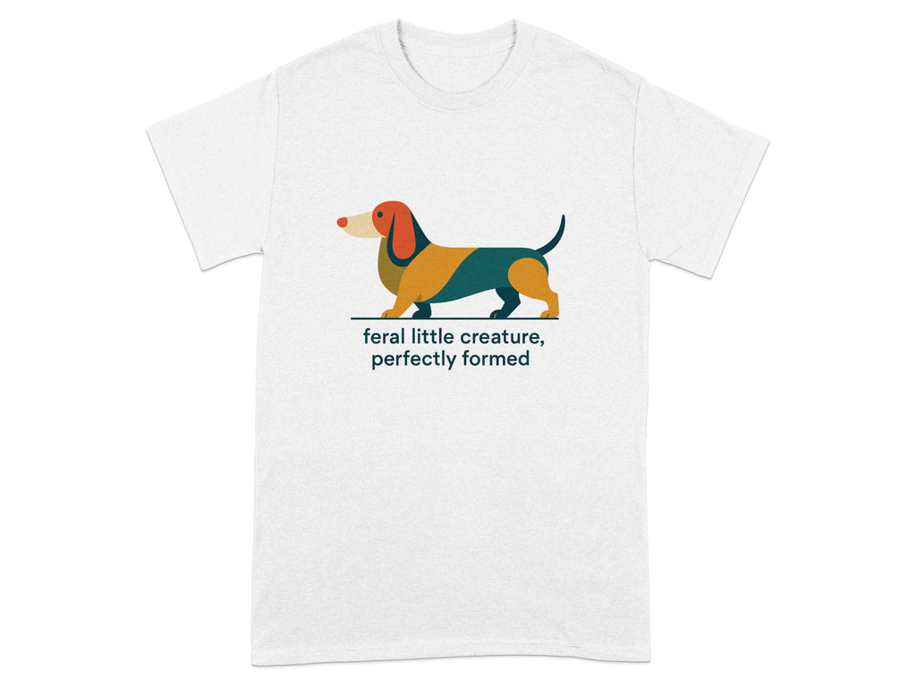 White t-shirt with colorful dachshund graphic and text reading "feral little creature, perfectly formed".
