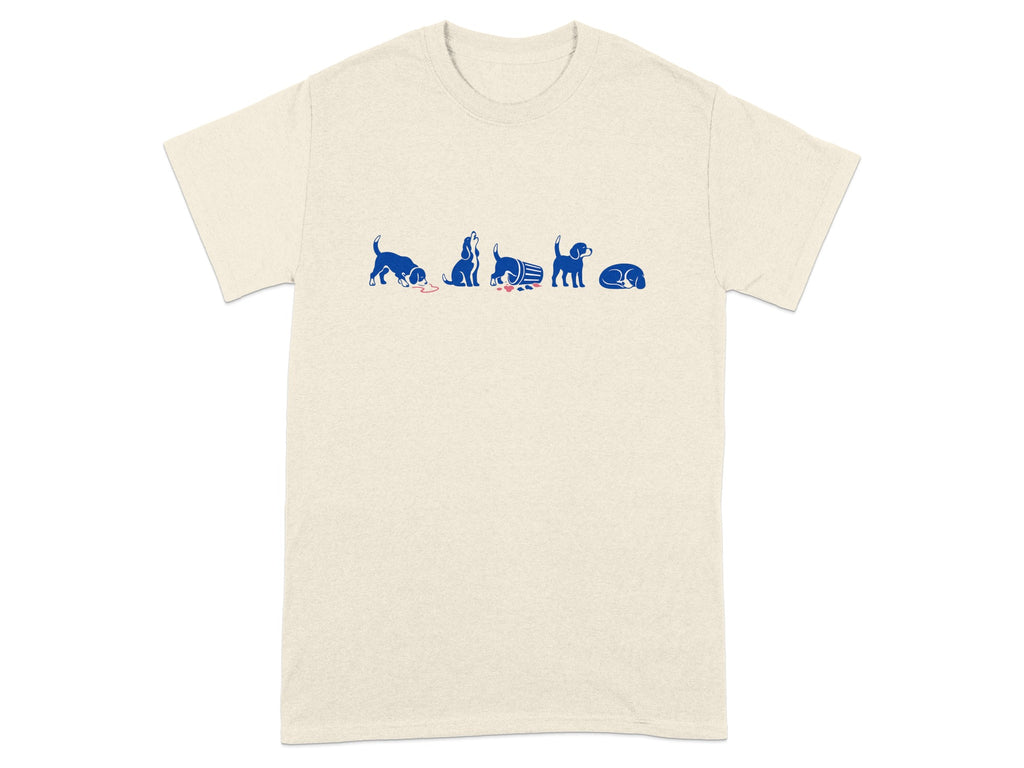Cream t-shirt with blue cartoon dogs in a line, spilling food and sleeping.