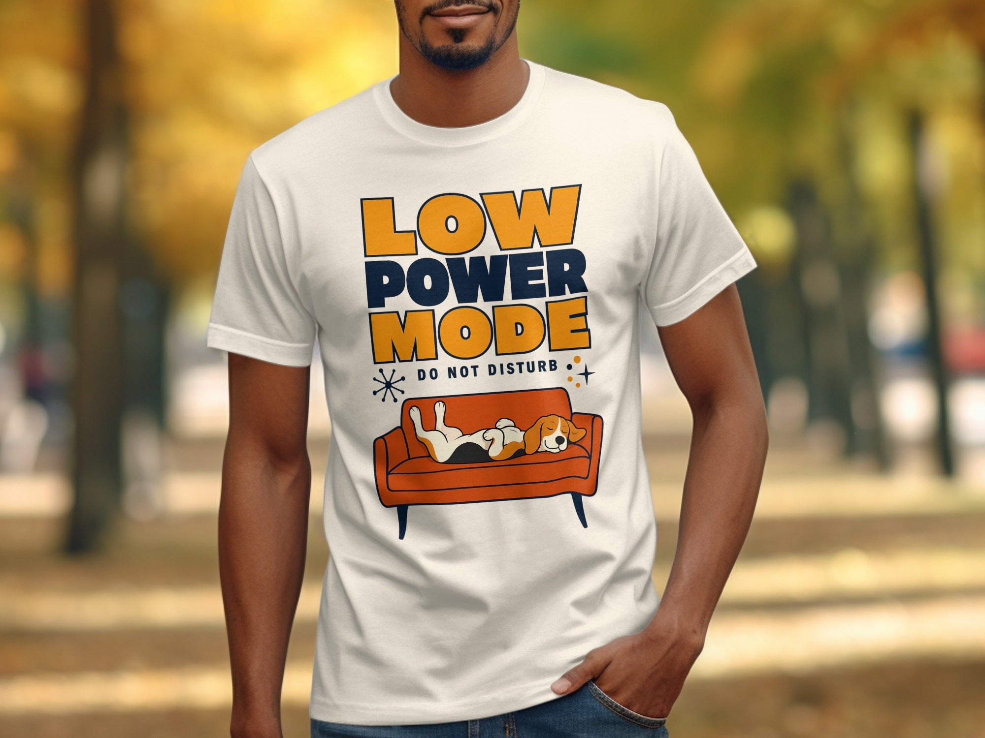 White t-shirt with "LOW POWER MODE DO NOT DISTURB" and dog on couch.