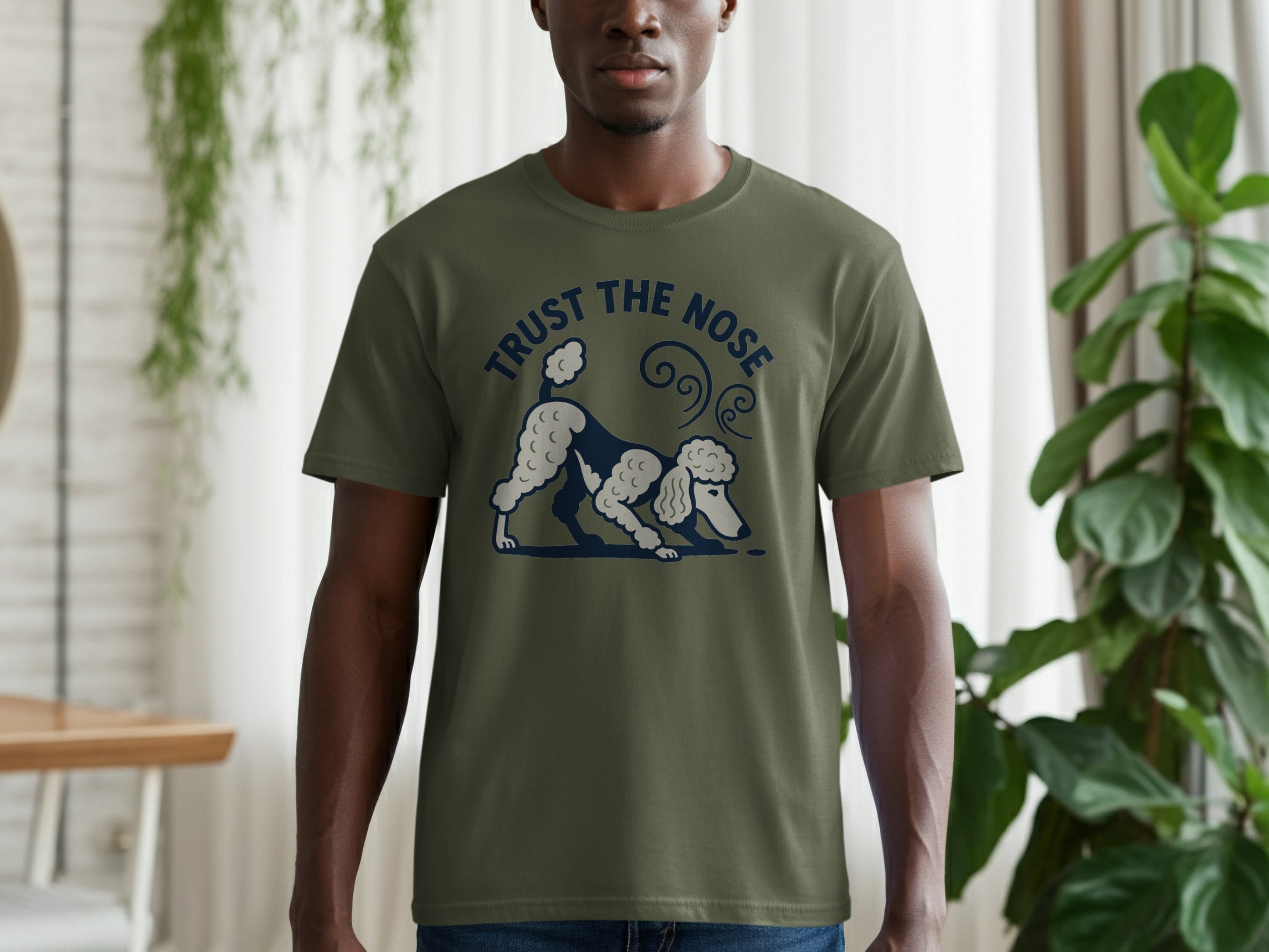Olive green t-shirt with a poodle graphic and text "TRUST THE NOSE".