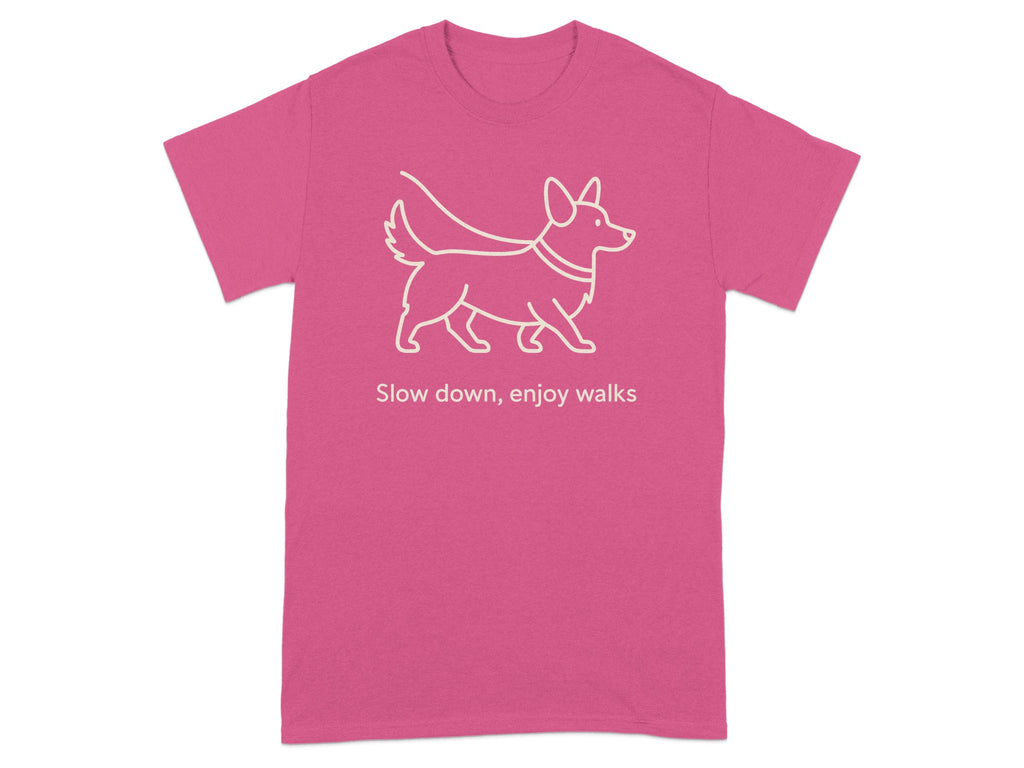 Pink t-shirt with white line drawing of a corgi and text "Slow down, enjoy walks".