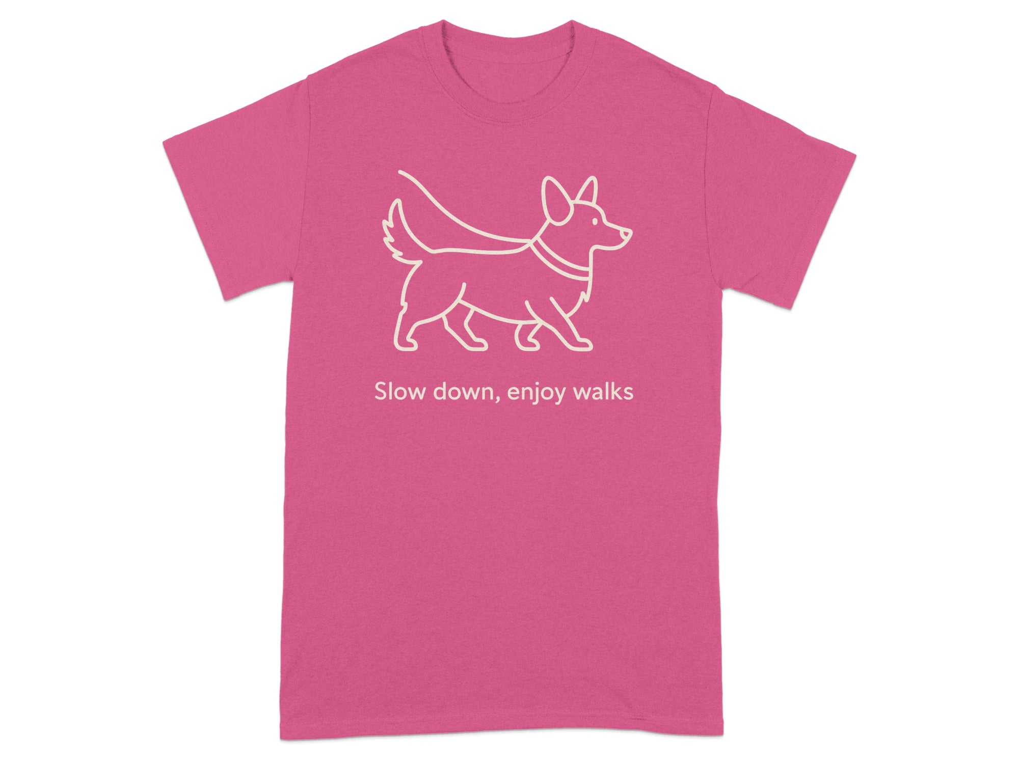 Pink t-shirt with white line drawing of a corgi and text "Slow down, enjoy walks".