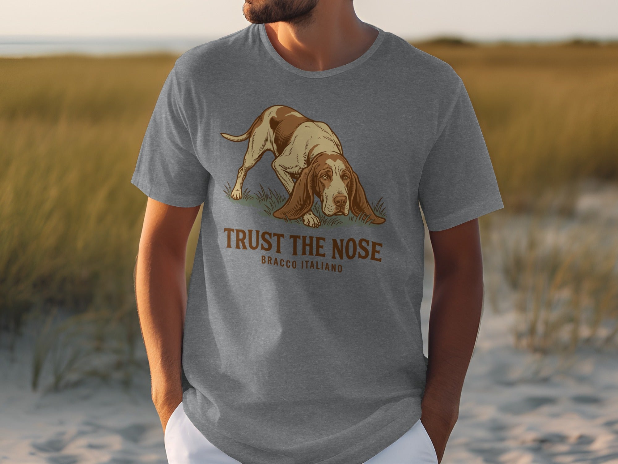 Grey t-shirt featuring a Bracco Italiano dog with "TRUST THE NOSE" text.
