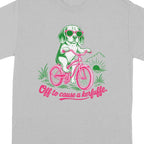 Grey t-shirt with graphic of dog on bicycle wearing sunglasses and text "Off to cause a kerfuffle".