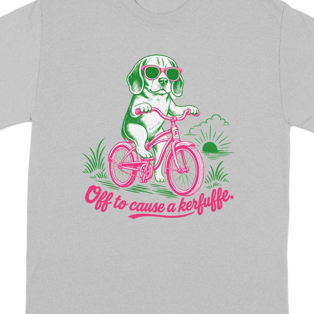 Grey t-shirt with graphic of dog on bicycle wearing sunglasses and text "Off to cause a kerfuffle".