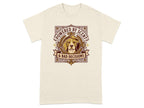 Cream t-shirt with a dog's head in a shield, text reads "Powered By Scent & Bad Decisions".